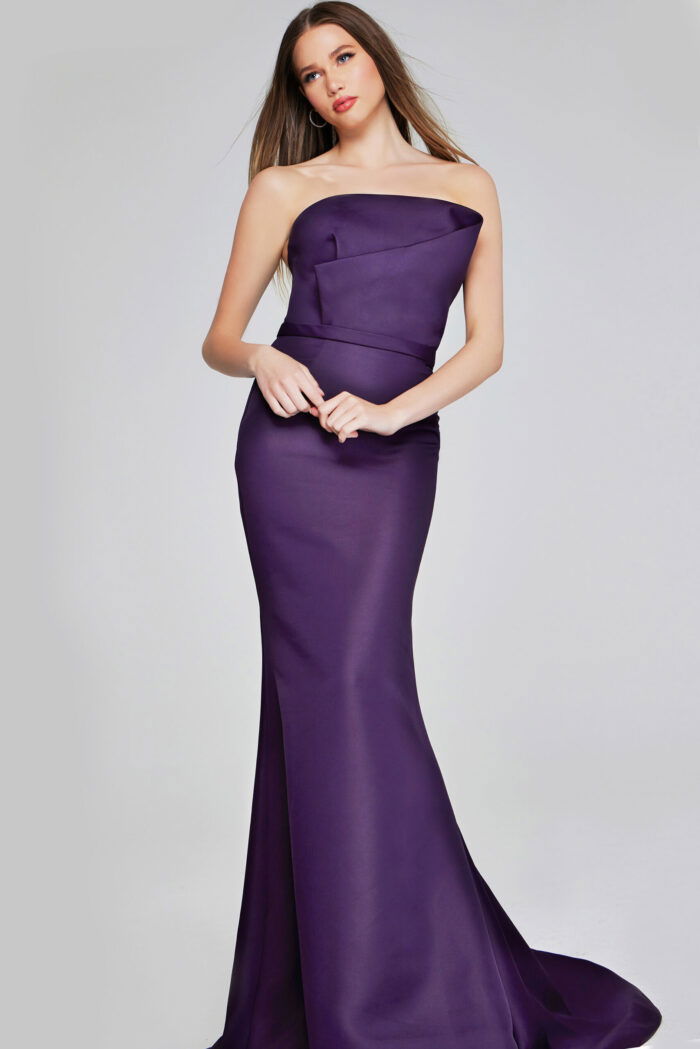 model wearing Jovani 40598 purple mermaid gown with strapless neckline
