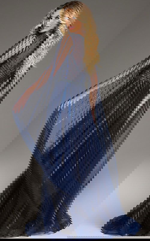 Back view of Jovani 40629 navy gown with long sheer embellished sleeves.