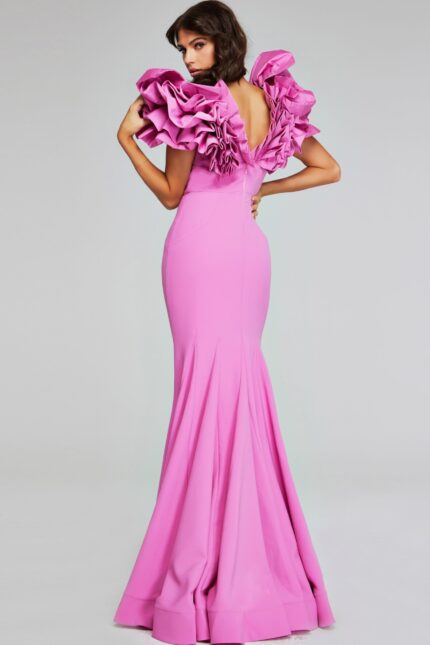 Model wearing Jovani 40663 pink mermaid dress showing the back with ruffled design