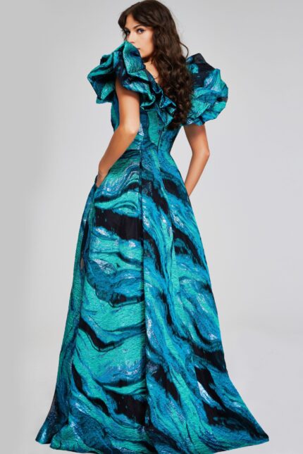Model showing back view of Jovani 40696 blue gown with ruffled sleeves.
