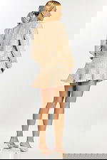 Back view of short champagne sequin dress and coordinating textured jacket