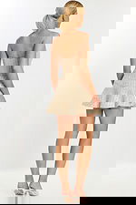 Rear view of strapless tweed mini dress with flared hem