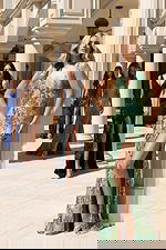 Elegant sequin gowns with deep V-necklines and high slits in multiple colors