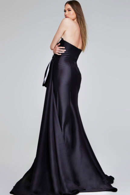 Back view of model in Jovani 40792 black gown showcasing elegant silhouette.