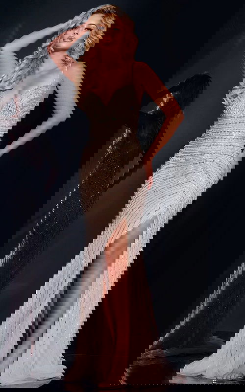 Model wearing Jovani 40820 silver gown with sweetheart neckline and high slit.