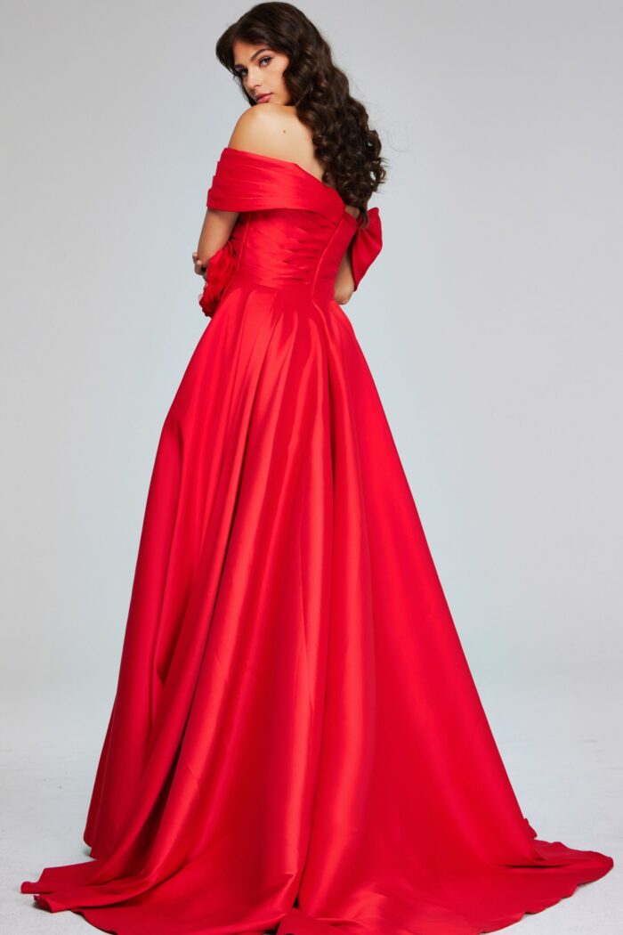 Model wearing Jovani 40832 red gown showing full back view with elegant draping