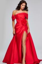 Model wearing Jovani 40832 red gown featuring an off-shoulder neckline and high slit