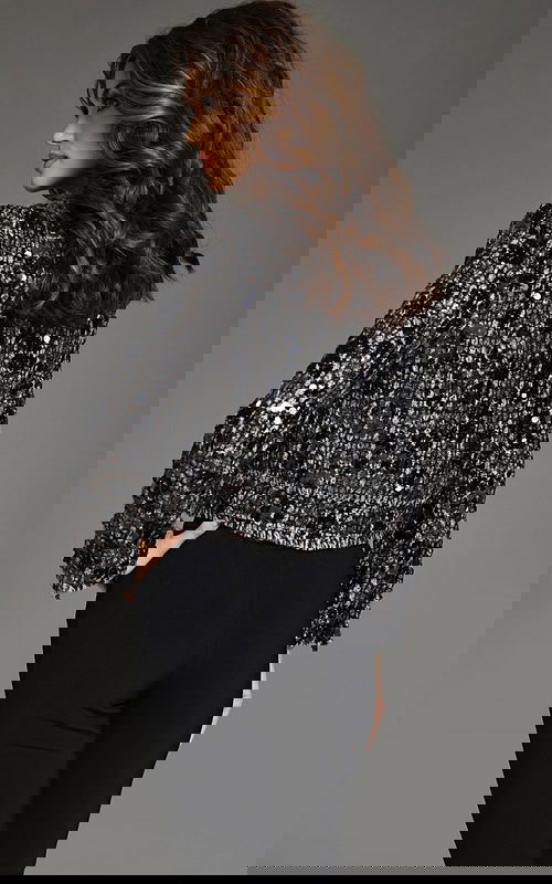 model wearing Jovani 40839 black sequin top and pants close-up from the front