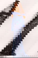 Back view of navy lace gown with sheer embroidered details