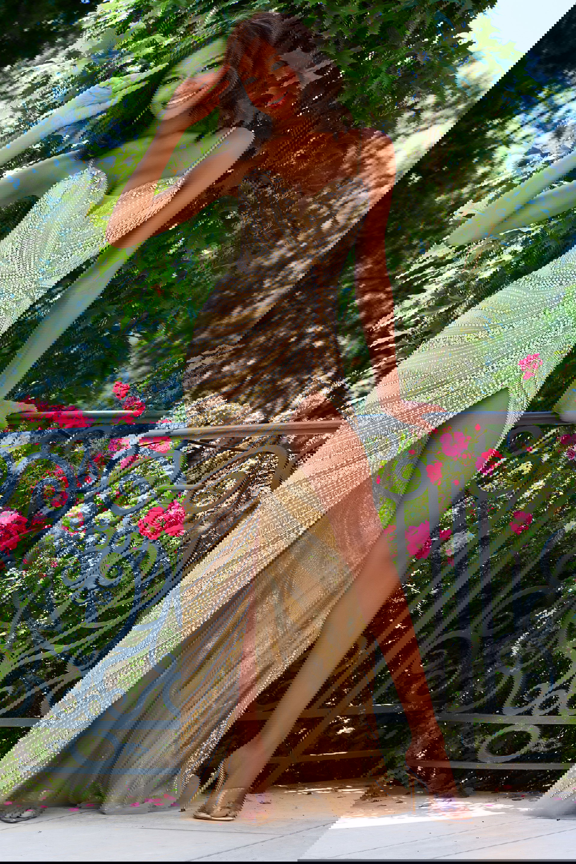 40877-high-slit Model wearing Jovani 40877 nude dress with high slit and beadwork in front view