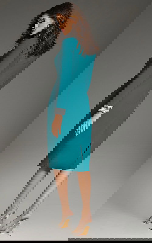 Model wearing Jovani 40910 blue dress with embellished cuffs, back view.