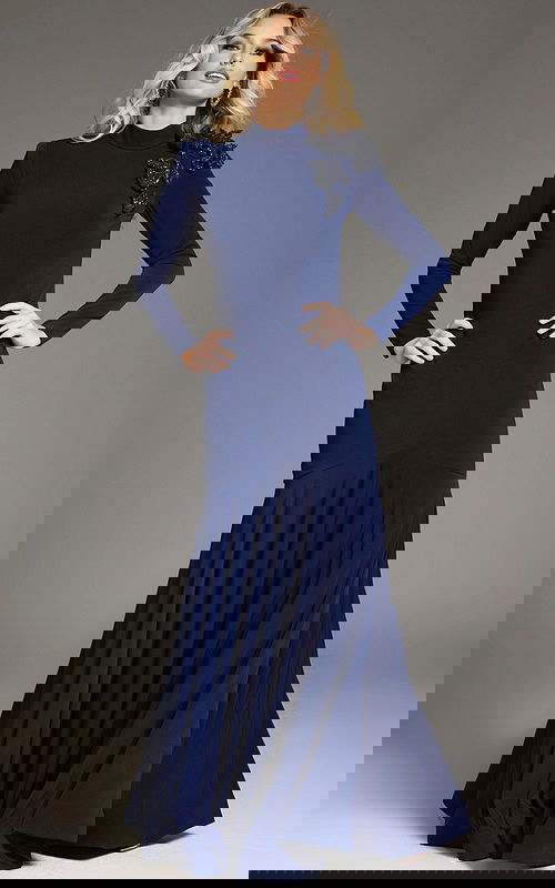 Model wearing Jovani 40926 navy dress with mermaid silhouette and floral embellishment from the front.