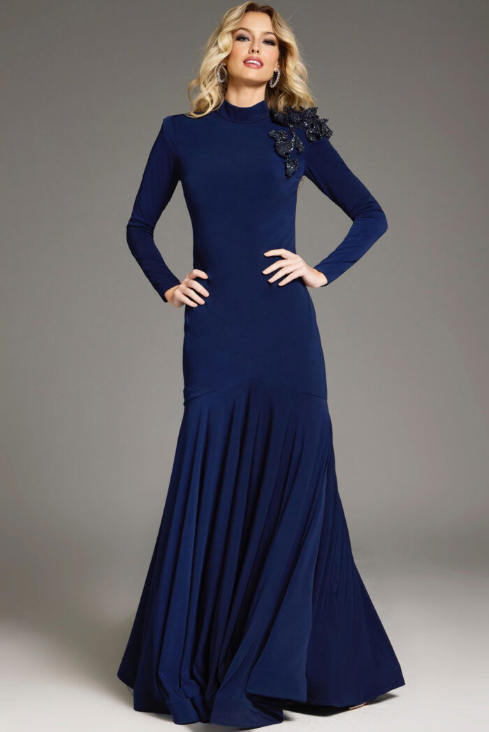Model wearing Jovani 40926 navy dress with mermaid silhouette and floral embellishment from the front.