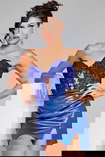 Model wearing Jovani 40937 royal blue dress with beaded lace bodice and high slit.