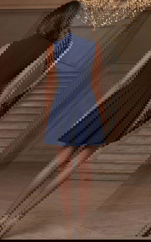 Back view of structured sleeveless short dress with fitted waist and flared skirt