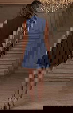 Back view of structured sleeveless short dress with fitted waist and flared skirt