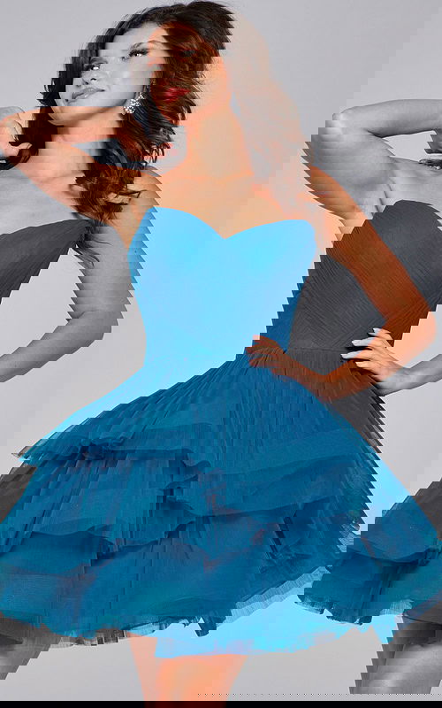 Model wearing Jovani 41054 blue dress showcasing sweetheart neckline and layered tulle, front view.