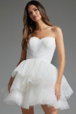 Model wearing Jovani 41054 white dress with strapless sweetheart neckline and layered skirt, front view.