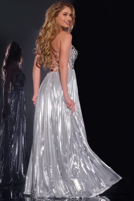 Model showing back of Jovani 41117 silver dress with lace-up detailing.