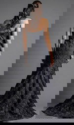 Back view of strapless evening gown with textured fabric and floor length flared hem