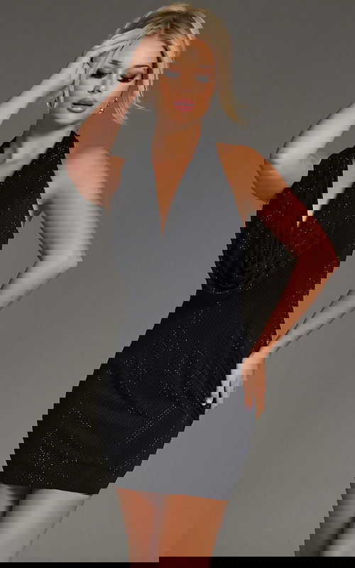 Close-up of model in Jovani 41197 black draped halter dress.