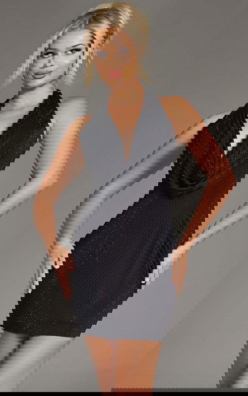 Model wearing Jovani 41197 black dress with halter neckline and cowl drape.