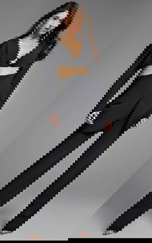 Sophisticated black suit featuring a cropped top with crystal embellishments