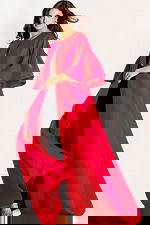 Dramatic floor-length cape with flared sleeves and open front design in rich satin fabric.