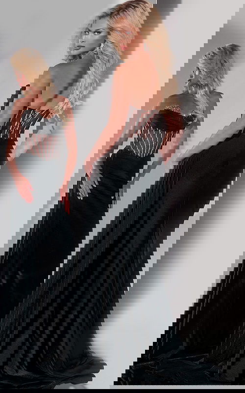 Back view of Jovani 42226 black gown showcasing sheer embellishments.