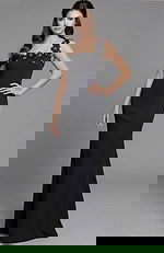 Front view of a fitted gown with floral appliqué neckline and asymmetric strap