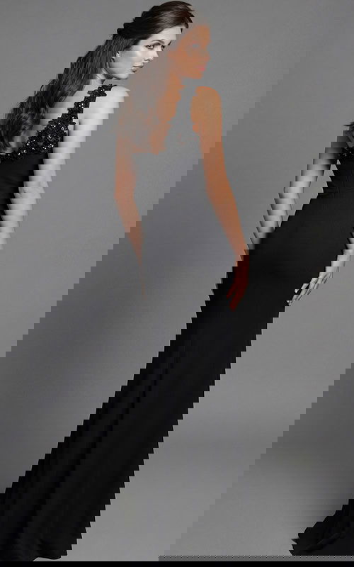 Back view of a fitted gown with floral appliqué detail and clean open back line