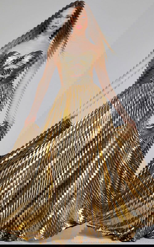 Model wearing Jovani 42335 gold gown with sweetheart neckline and floral accents, front view.