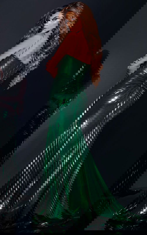 Model wearing Jovani 42336 green dress, back view showing elegant draping