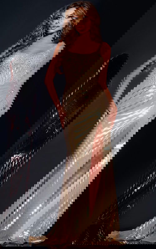 Model wearing Jovani 42343, gold gown with beaded bodice and high slit.