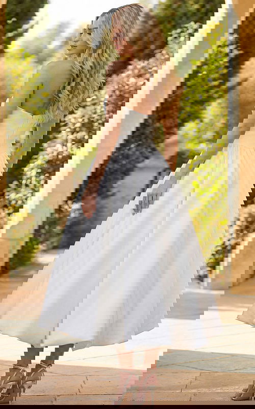 Strapless white high low wedding dress with full bubble skirt and back view details