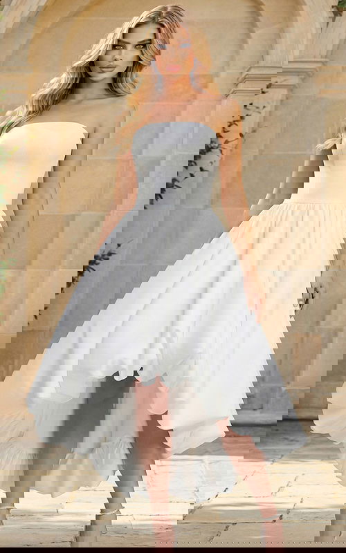 Strapless high low white bridal dress with voluminous bubble hem and fitted bodice