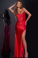 Model wearing Jovani 42370 red gown with elegant beadwork and high slit.