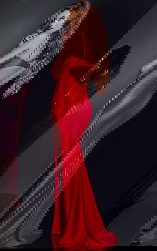 Back view of model wearing Jovani 42370 red gown with open back design.