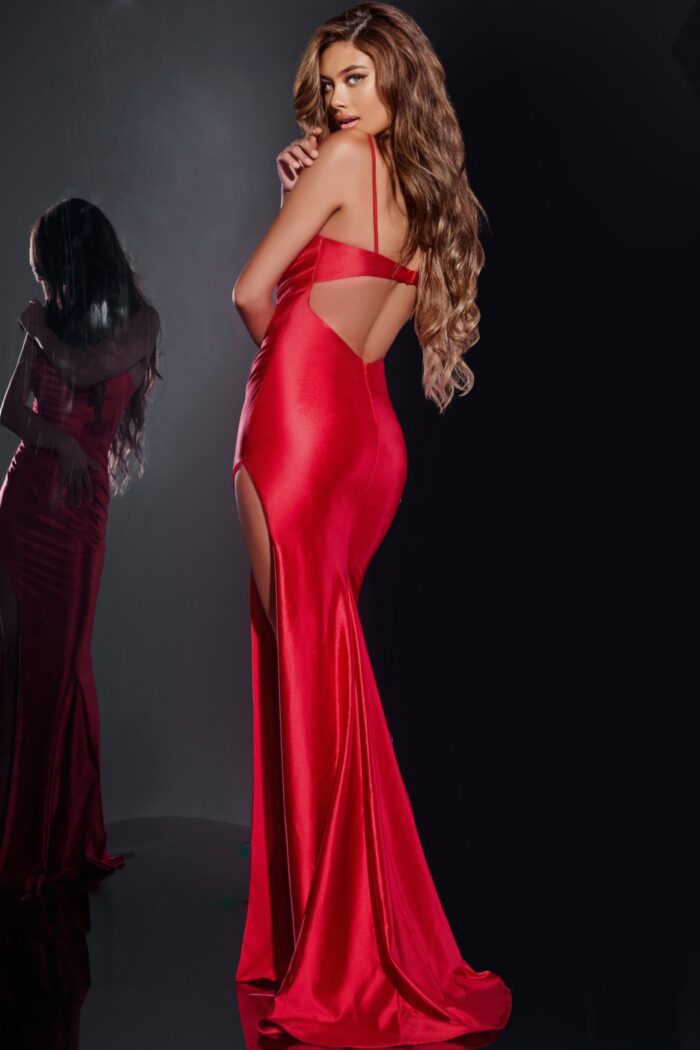 Back view of model wearing Jovani 42370 red gown with open back design.