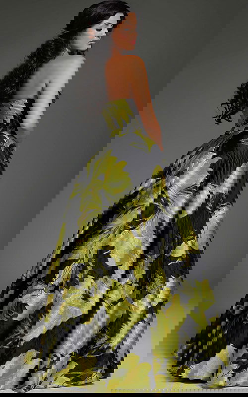 model wearing 42435 yellow floral dress with a strapless neckline and A-line silhouette, back view