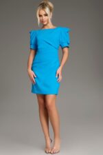 Model wearing Jovani 42445 in blue, front view with puff sleeves and bateau neckline.