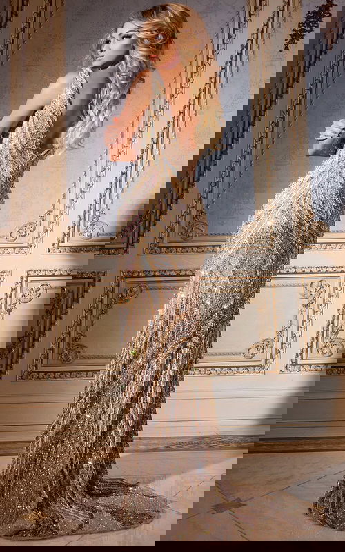 Model in Jovani 42512 nude gown, back view highlighting dazzling beading.