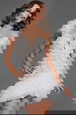 Model wearing Jovani 42536 dress in ivory, showcasing sweetheart neckline and tulle skirt.