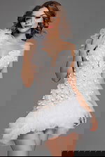 Model wearing Jovani 42536 dress in ivory, close-up front view of floral details.