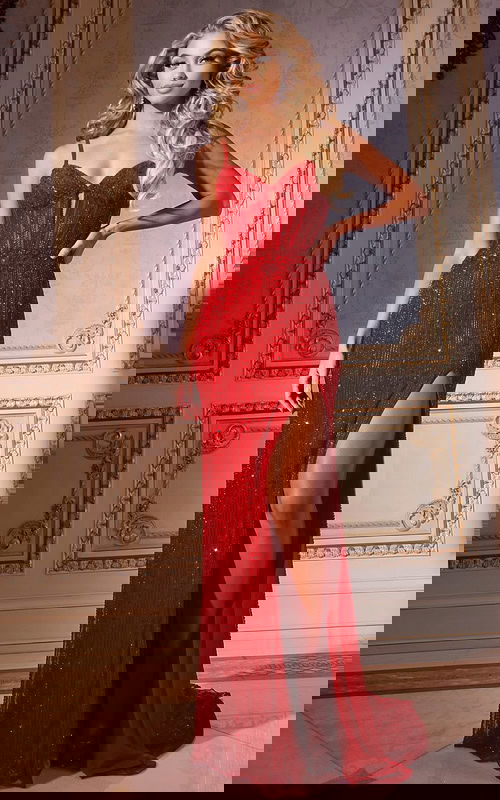 Model in Jovani 42541 red gown with sweetheart neckline and high slit.