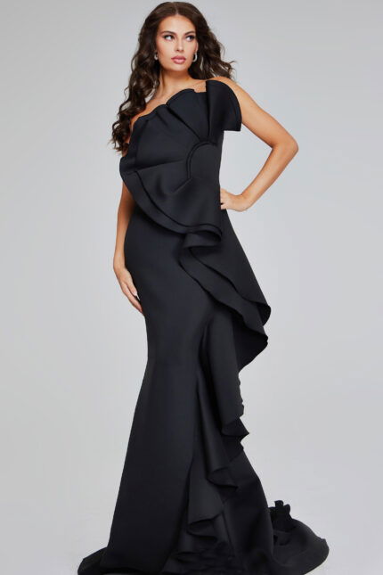 model wearing Jovani 42543 black strapless gown with oversized ruffle detail, front view