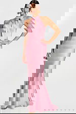 Woman wearing a mauve satin halter gown with a front bow tie and fit-and-flare silhouette.