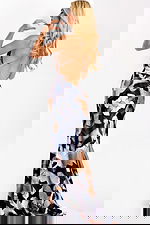 Sleek satin halter dress featuring plunging neckline and backless style