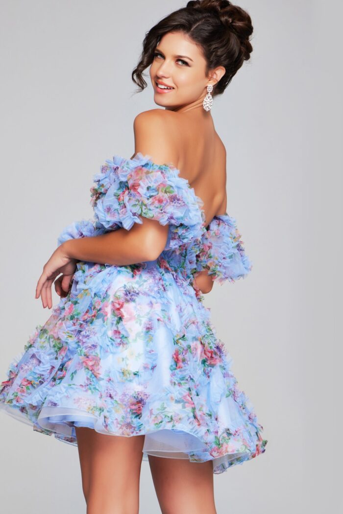 Model wearing Jovani 42573 blue dress, back view showing ruffles.
