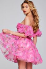 Model wearing Jovani 42573 pink dress, back view showing ruffles.